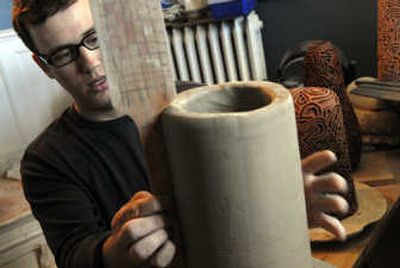 
Kevin Bouck works on a clay piece in his studio on the South Hill    June 12.  
 (Holly Pickett / The Spokesman-Review)