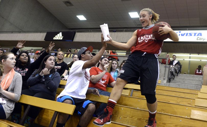 Eastern Washington's Lexie Nelson runs down the bleacher stairs to the court as she is introduced at a kickoff event for the Eagles' basketball teams Thursday, Oct. 23, 2014 at Reese Court at EWU. (Jesse Tinsley / The Spokesman-Review)