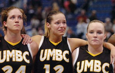 
UMBC's Heather Luttrell, Sharri Rohde, and Carlee Cassidy, left to right, react to their team's 82-33 loss to Connecticut. 
 (Associated Press / The Spokesman-Review)