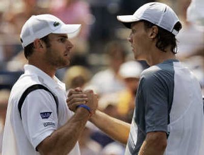 
Andy Roddick, left, consols Tomas Berdych after the Czech retired in the second set because of breathing problems.Associated Press
 (Associated Press / The Spokesman-Review)