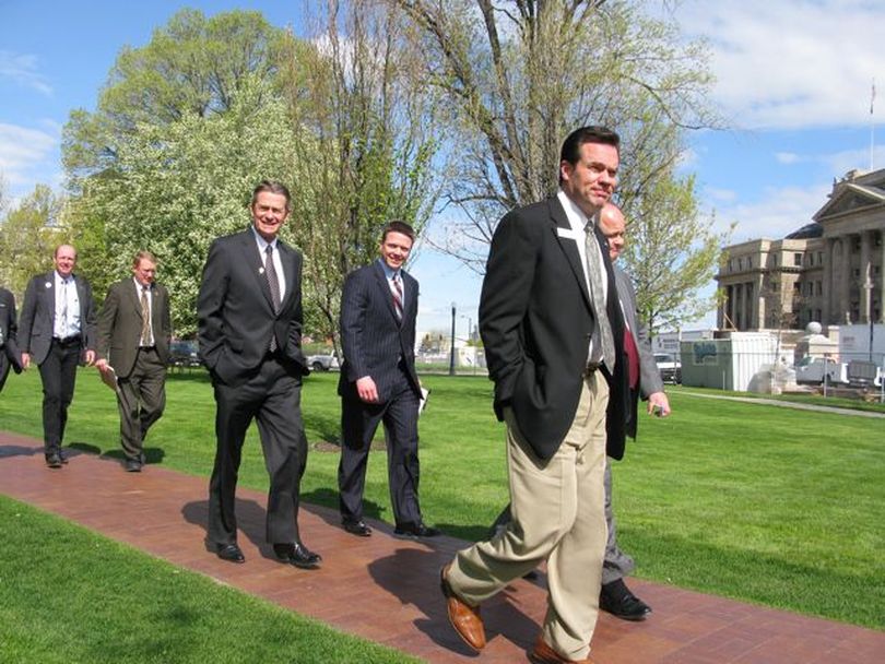 Senate and House leaders walk across Capitol Park, returning to the Capitol Annex from a meeting with Gov. Butch Otter on Wednesday morning. The meeting failed to yield a compromise on transportation funding. (Betsy Russell / The Spokesman-Review)