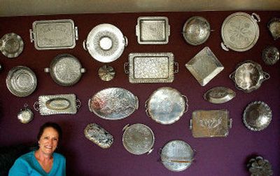 
Bonnie McNamara of Coeur d'Alene stands by her large collection of aluminum trays collected over eight years. 
 (Brian Plonka / The Spokesman-Review)