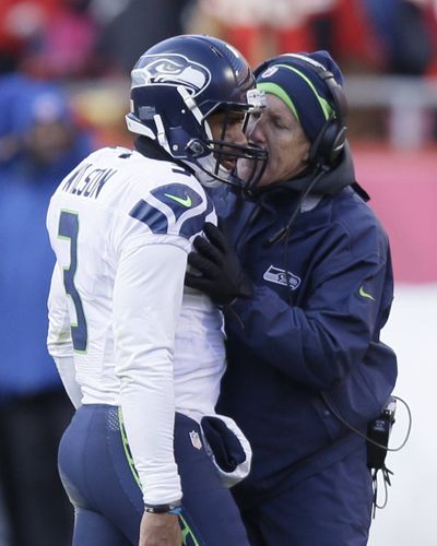 Russell Wilson and Pete Carroll have work cut out. (Associated Press)