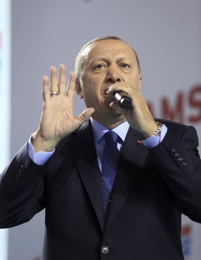 Turkey’s President Recep Tayyip Erdogan addresses the members of his ruling party in Samsun, Turkey, Saturday, March 24, 2018. Erdogan has criticized anti-war students at a top university, calling them terrorists following a fight there. (Murat Cetinmuhurdar / Associated Press)