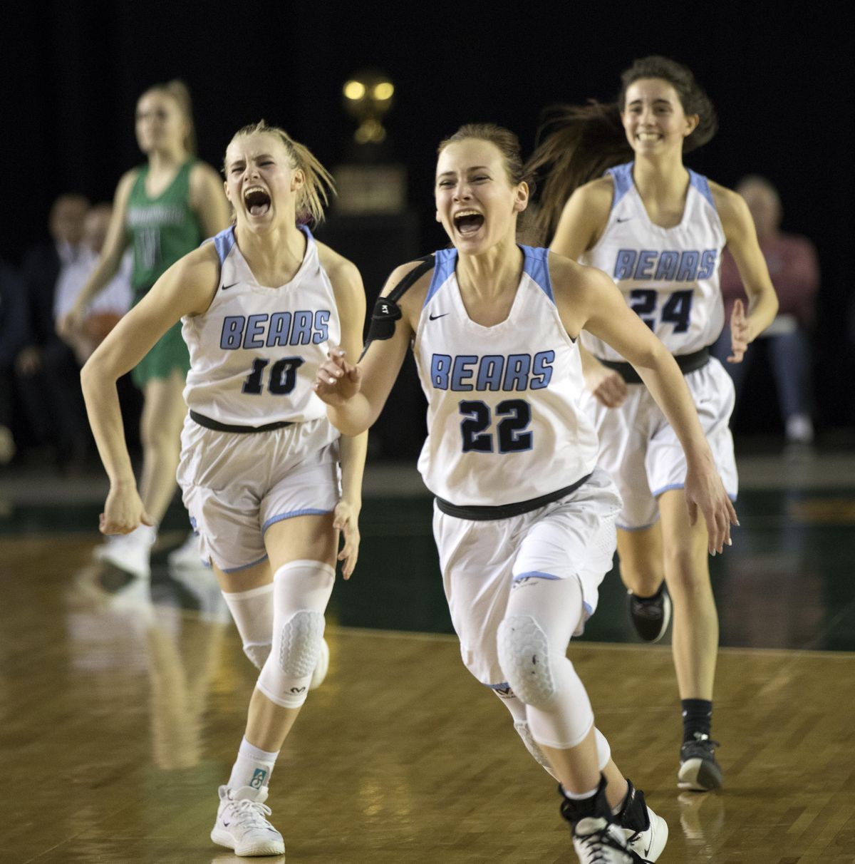 Central Valley players (from left) MJ Bruno, Grace Geldien and Chloe Williams celebrate the State 4A championship win over Woodinville on Saturday, March 7, 2020, in Tacoma, Wash. All three players return this season.  (Patrick Hagerty/For The Spokesman-Review)