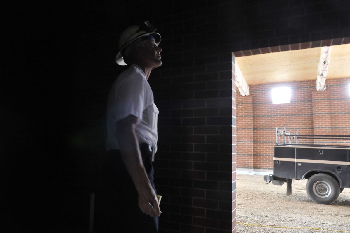 Deputy Chief Larry Rider looks at the workmanship and materials inside the new Spokane Valley fire station going up in the 6300 block of East Sprague Avenue Wednesday. Station 6 will serve the area that extends west to Havana Street and east approximately 1.5 miles. It is scheduled to open in November. (Jesse Tinsley)