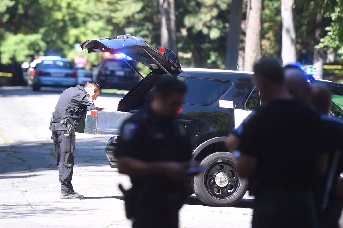 Police investigate a shooting Saturday, August 20, 2016 at Manito Park in Spokane. A gunshot was heard and a woman was found with a wound to her arm. (Jesse Tinsley / The Spokesman-Review)