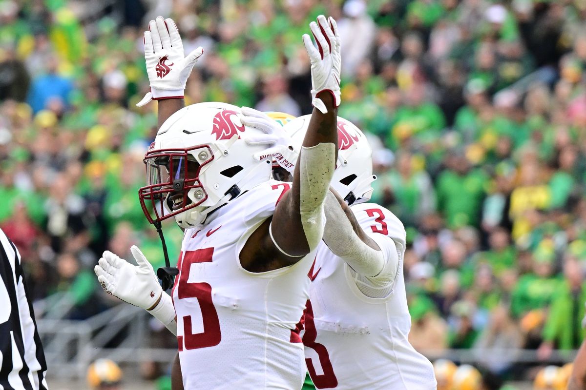Washington State running back Nakia Watson reacts after scoring a touchdown against Oregon on Oct. 21 at Autzen Stadium in Eugene.  (Tyler Tjomsland/The Spokesman-Review)
