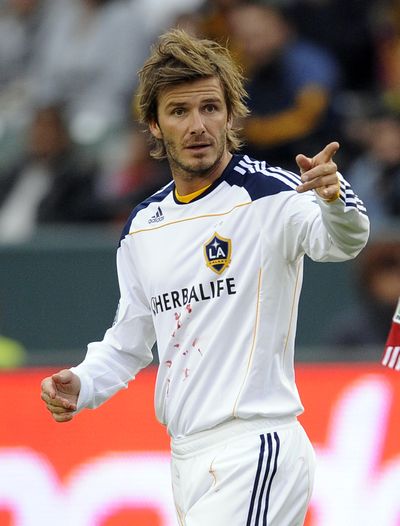 Los Angeles Galaxy midfielder David Beckham will finish his contract with the MLS club. He wants to return to England. (Associated Press)