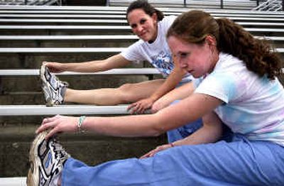 Freeman High School seniors Amber Raines and Ariel Grubb stretch out before practice recently. The two have been long-distance running partners for several years. Freeman High School seniors Amber Raines and Ariel Grubb stretch out before practice recently. The two have been long-distance running partners for several years.
(Steve Thompson/Steve Thompson/ / The Spokesman-Review)