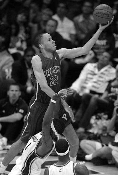 
Detroit Pistons' Tayshaun Prince runs over Cleveland Cavaliers' Daniel Gibson on a drive. 
 (Associated Press / The Spokesman-Review)