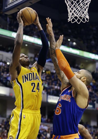 Indiana Pacers’ Paul George, left, scored a team-high 24 points. (Associated Press)