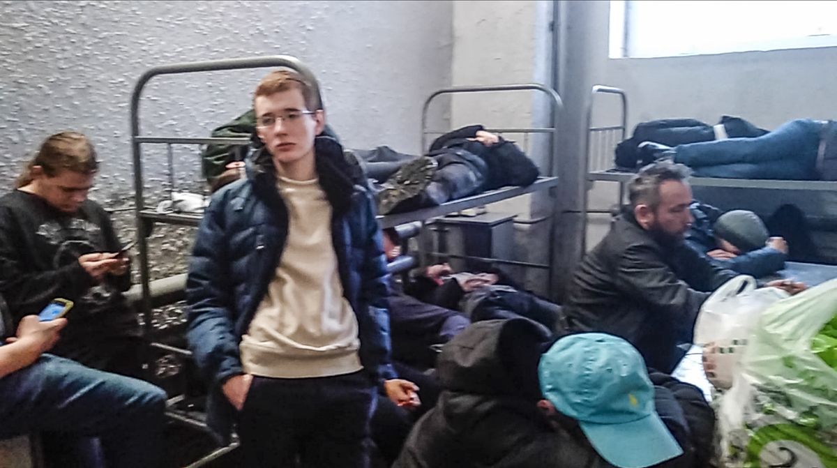 This image taken from a video filmed by Dmitry Shelomentsev shows, a group of detained people inside the deportation centre Sakharovo, 70km (43,7 miles) south-west of Moscow which was urgently transformed into a detention center in the absence of prison space, in Moscow, Russia, Thursday, Feb. 4, 2021. Dmitry Shelomentsev was among those who had to wait in a police bus for hours at Sakharavo before being taken in. Sentenced to 15 days in jail for participating in the Tuesday rally, Shelomentsev messaged the AP reporter on Feb. 4, 2021 morning from a cell for eight inmates where 28 people were held, awaiting transfer to smaller ones. (Dmitry Shelomentsev)