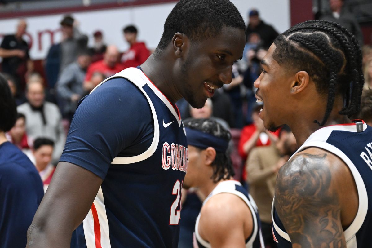 Gonzaga Bulldogs center Ismaila Diagne (24) and guard Khalif Battle (99) celebrate after defeating the Santa Clara Broncos during the second half of a college basketball game on Tuesday, Feb. 25, 2025, at the Leavey Center in Santa Clara, Calif. Gonzaga won the game 95-76. (Tyler Tjomsland/The Spokesman-Review)