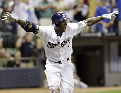 Brewers’ Nyjer Morgan starts the party after hitting the winning single in the 10th inning to send the Brewers to the NLCS. (Associated Press)