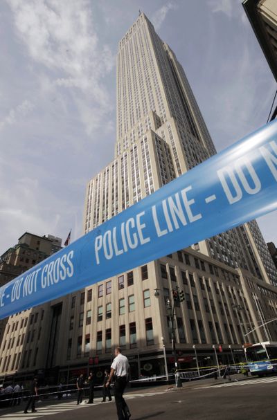 Police crime scene tape blocks 34th Street at Fifth Avenue after a shooting outside the Empire State Building on Friday. (Associated Press)
