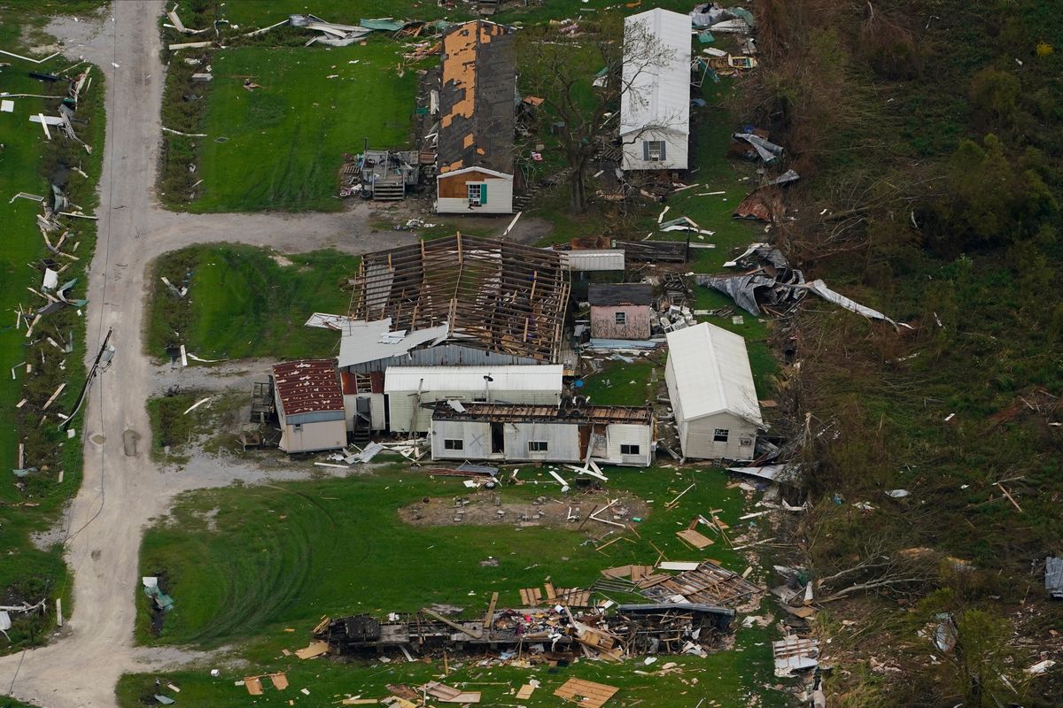 FILE - In this aerial photo, the remains of destroyed homes are seen in the aftermath of Hurricane Ida, Sept. 6, 2021, in Lafitte, La. Damage wrought by Hurricane Ida in the U.S. state of Louisiana and the flash floods that hit Europe last summer have helped make 2021 one of the most expensive years for natural disasters. Reinsurance company Munich Re said Monday, Jan. 10, 2022 that overall economic losses from natural disasters worldwide last year reached $280 billion.  (Matt Slocum)