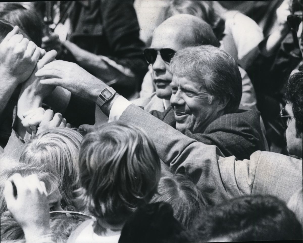 President Jimmy Carter wades into the crowd May 5, 1978, on his visit to Spokane to dedicate Riverfront Park. Carter died Sunday at his home in Plains, Ga. He was 100.  (Spokesman-Review archives)