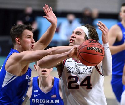 Gonzaga forward Corey Kispert (24) is fouled by BYU guard Trevin Knell (21) during the second half of a West Coast Conference Tournament final NCAA college basketball game, Tuesday, March 9, 2021, at the Orleans Arena in Las Vegas.  (Colin Mulvany / The Spokesman-Review)