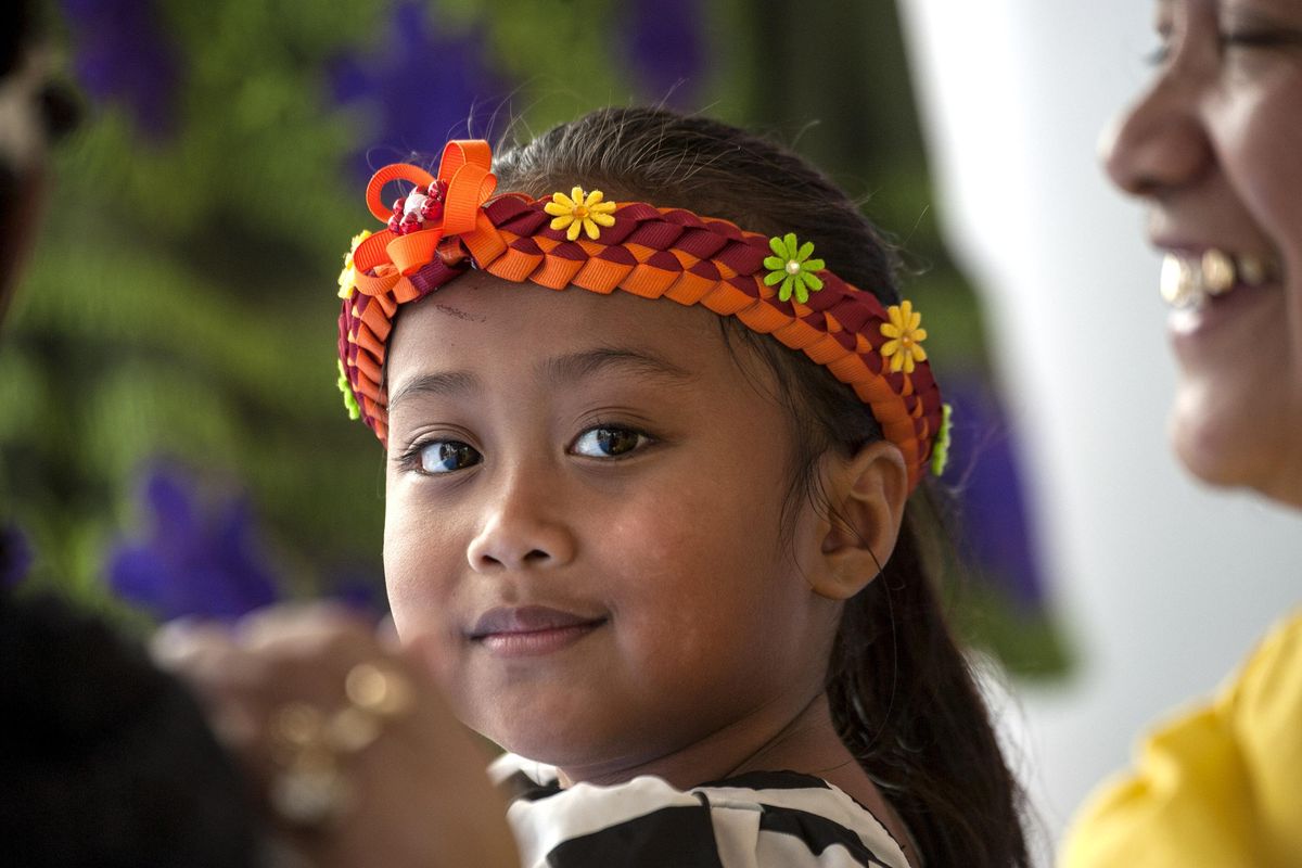 Five-year-old Avi Miosy helped out in the Micronesia area of the 25th Annual Unity in the Community at Riverfront Park in Spokane on Saturday, August 17, 2019. The region’s largest multi-cultural event consists of a Cultural Village, Entertainment, Career/Education Fair, Youth Area, Health Fair, Senior Resources and General Vendors. (Kathy Plonka / The Spokesman-Review)