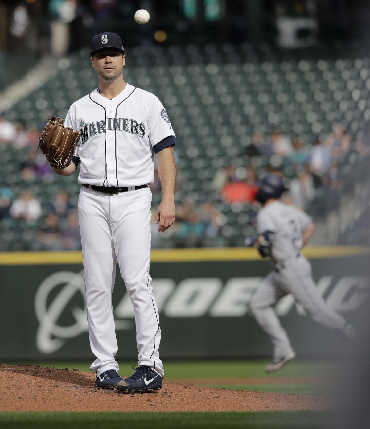 Seattle Mariners starting pitcher Wade LeBlanc tosses the baseball as San Diego Padres