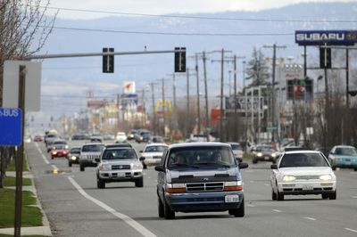 Traffic flows west on Sprague Avenue on Tuesday on the one-way stretch between Argonne and University. Planners are looking at ways to make  development along Sprague  look more cohesive and welcoming and to encourage walking between establishments.  (Jesse Tinsley / The Spokesman-Review)