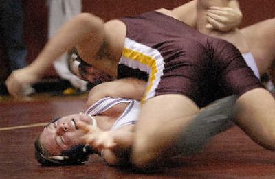 
Moses Lake's Jordan Hill holds down CV's Jeff Croskrey in 135-pound final. 
 (Ingrid Lindemann / The Spokesman-Review)