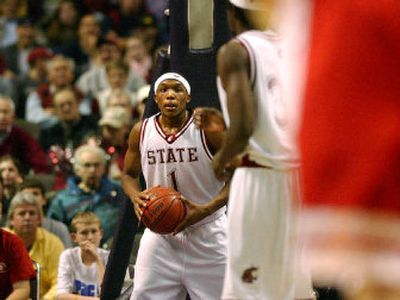 
WSU sophomore guard Josh Akognon, known as a streak shooter, controls the ball against Arizona in the Spokane Arena. 
 (Brian Plonka / The Spokesman-Review)