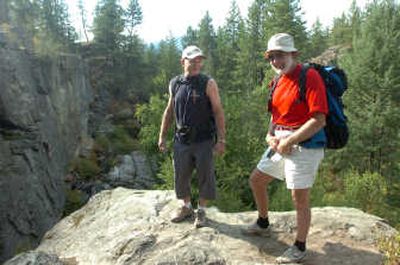 
Climbing buddies Richard LeFrancis, left, and Rusty Baillie stand above the popular climbing walls at Q'emiln Park last month. The two have improved climbing and hiking in Post Falls. It took three or four full days to shape up each climbing route. 
 (Photos by JESSE TINSLEY / The Spokesman-Review)
