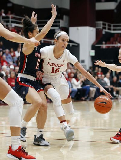 Stanford's Lexie Hull (12) drives for the basket as Gonzaga's Jessie Loera defends during the first half of an NCAA college basketball game Sunday, Nov. 17, 2019, in Stanford, Calif. (George Nikitin / Associated Press)