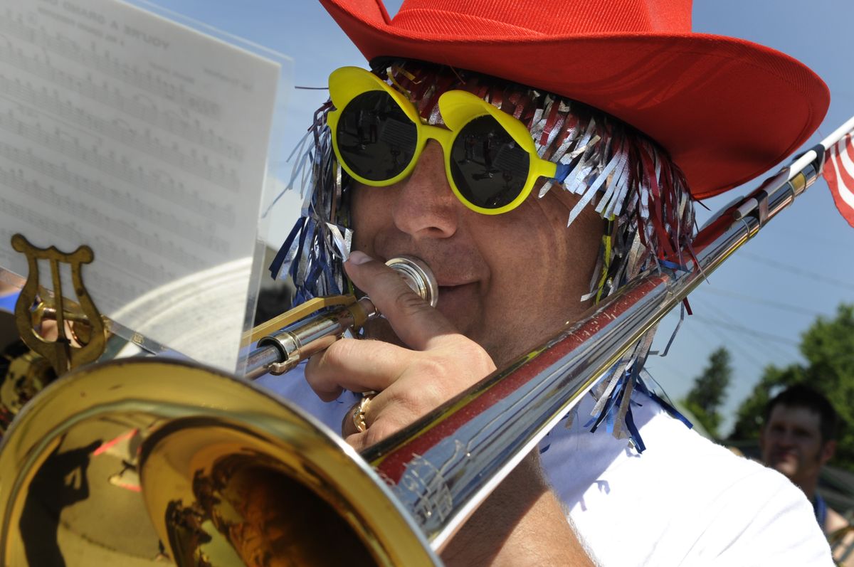 Dennis Grant, a member of the Perfection-Nots, plays his trombone while marching in this year’s Coeur d’Alene  Fourth of July Parade Saturday. (Colin Mulvany / The Spokesman-Review)