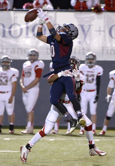 Mt. Spokane's Zach Vogel goes up for the interception against Ferris but receiver Jalen Hicks hooks him and the ball falls incomplete, Thursday, Oct. 2, 2014, at Joe Albi Stadium. (Jesse Tinsley / The Spokesman-Review)