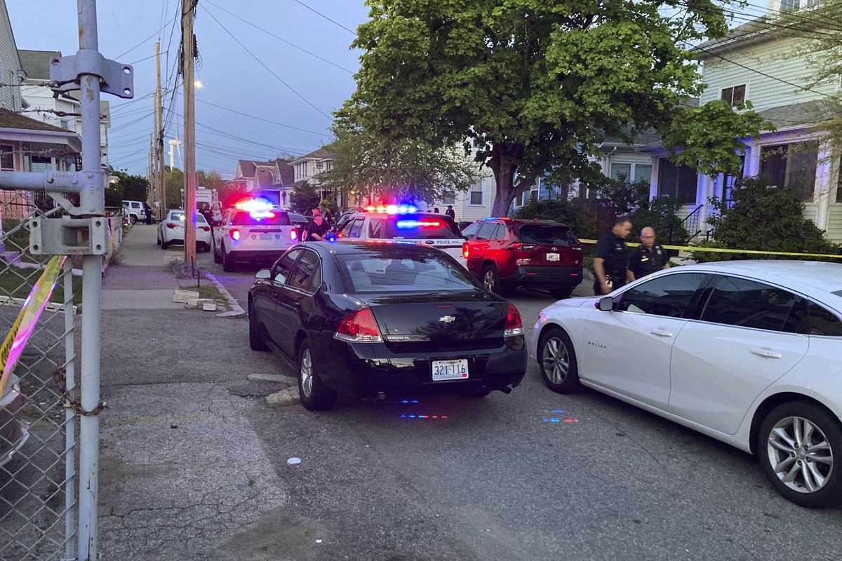 Authorities respond to the scene where multiple people were wounded in a shooting, Thursday, May 13, 2021, in Providence, R.I.  (William J. Kole)