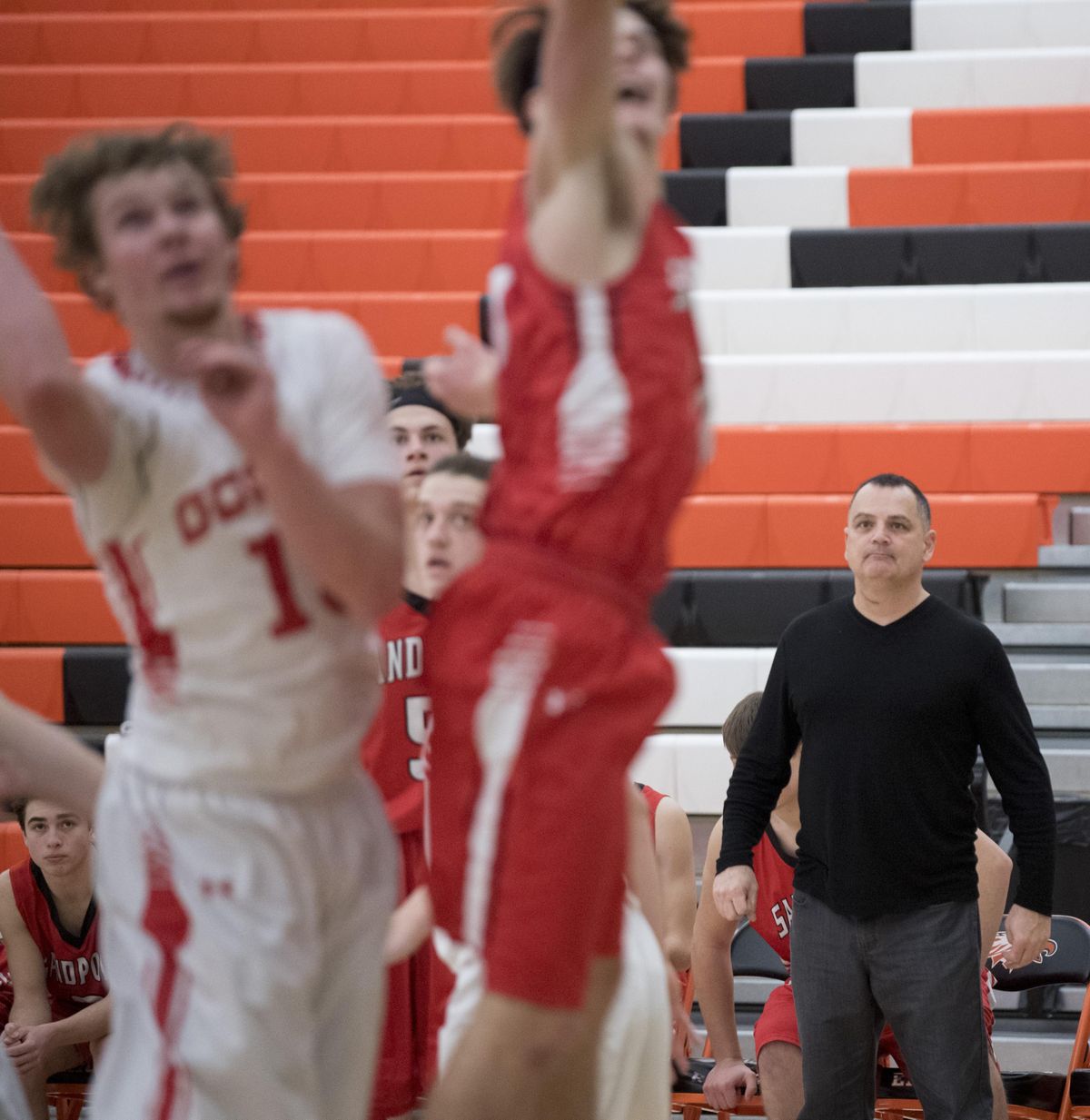 Coach Kent Leiss, right, watches his Sandpoint Bulldogs boys basketball team take on the Davenport Gorillas in the first game of the Eagle Holiday Classic, a basketball tournament for many smaller high schools around the region, Wednesday, Dec. 27, 2017 at West Valley High School. Sandpoint won the shortened game 48-45. The games continue through Friday. (Jesse Tinsley / The Spokesman-Review)