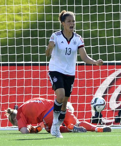 Germany's Celia Sasic celebrates in win over Sweden. (Associated Press)