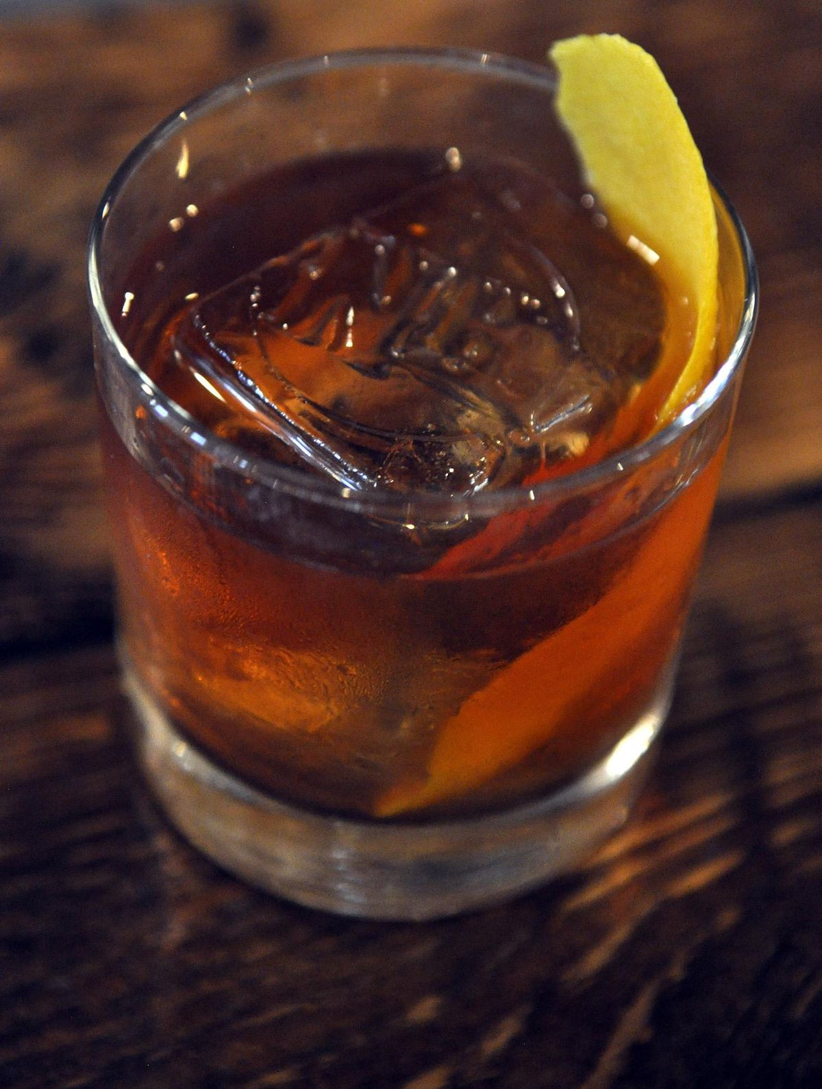 The Cornerstone House Old-Fashioned at the new North Hill on Garland features an ice cube stamped with the establishment’s initials. (Adriana Janovich / The Spokesman-Review)