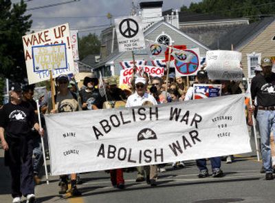 
Anti-war protesters walk down the main street of Kennebunkport, Maine, on Saturday, heading toward the Bush compound. 
 (Associated Press / The Spokesman-Review)