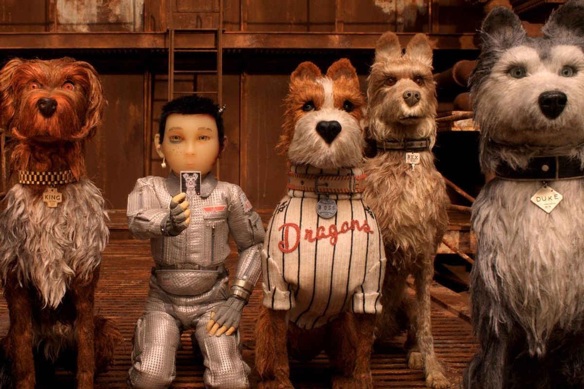 A 12-year-old boy (voice of Koyu Rankin, center) goes looking for his missing dog and encounters a pack of exiled dogs (from left, Bryan Cranston as Chief, Bob Balaban as King, Bill Murray as Boss, Edward Norton as Rex and Jeff Goldblum as Duke) in “Isle of Dogs.” (Fox Searchlight Pictures)