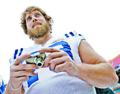 
Indianapolis offensive guard Jake Scott, using a tiny camera, takes advantage of media day at Dolphin Stadium in Miami on Tuesday. 
 (Associated Press / The Spokesman-Review)