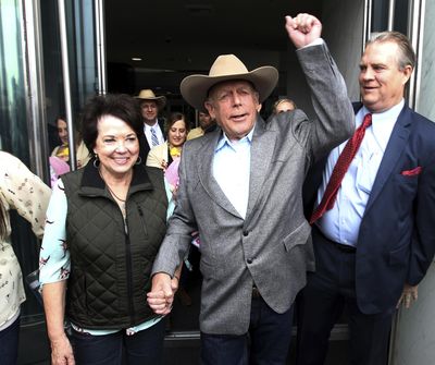 Cliven Bundy walks out of federal court with his wife Carol on Monday, Jan. 8, 2018, in Las Vegas, after a judge dismissed criminal charges against him and his sons accused of leading an armed uprising against federal authorities in 2014. (K.M. Cannon / Associated Press)