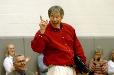 
Mike Clabby, a teacher at Lake City High School, holds a new laptop computer and wags his finger at the cheering student body after he was  named the  2007 Idaho Teacher of the Year on Wednesday. Clabby teaches classes on computer graphics and multimedia. 
 (Photos by Jesse Tinsley / The Spokesman-Review)