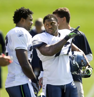 New Seattle Seahawks running back Edgerrin James, left, and fellow running back Julius Jones chat during practice Wednesday.  (Associated Press / The Spokesman-Review)