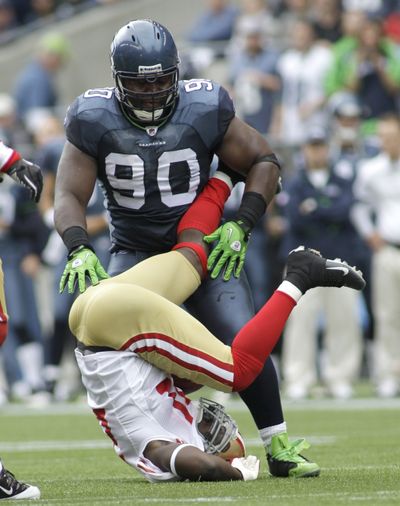 Lineman Colin Cole and the rest of the Seahawks’ defense did a solid job of keeping Frank Gore off balance and upending the 49ers in the season opener on Sunday. (Associated Press)