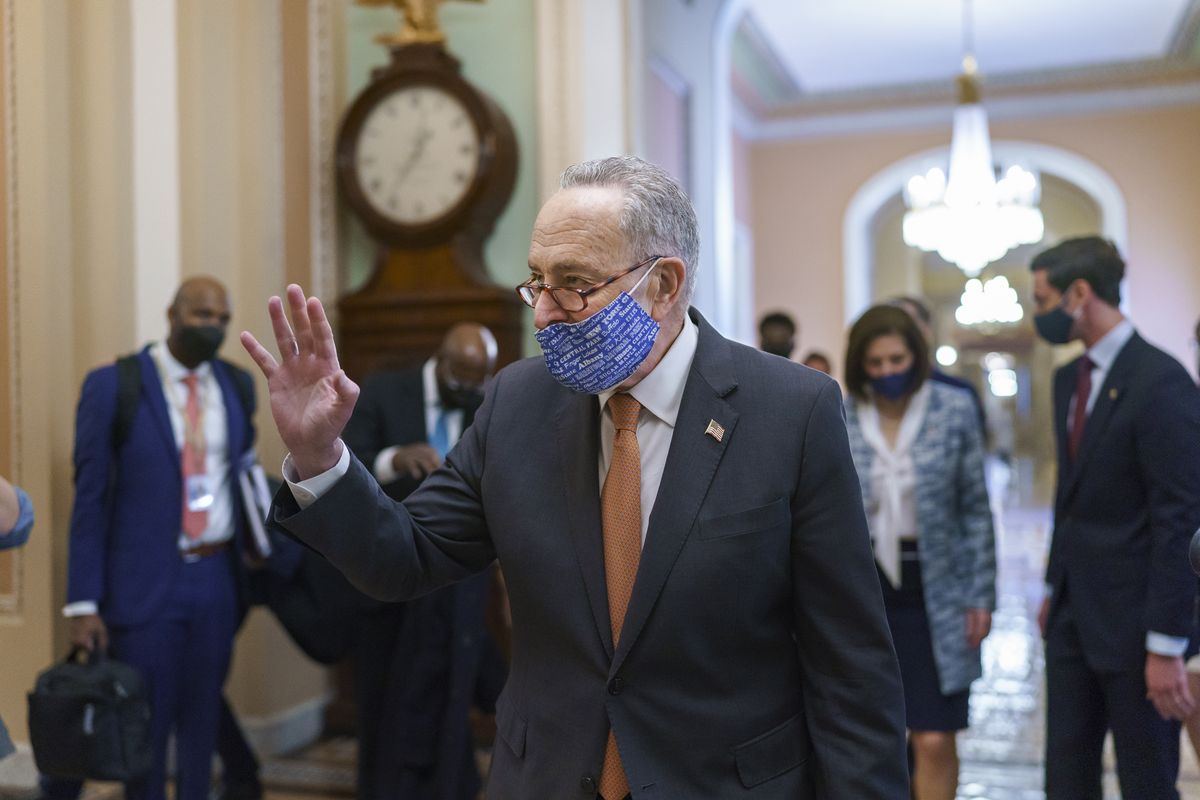 On the first full day of Democratic control, Senate Majority Leader Chuck Schumer, D-N.Y., walks to the chamber after meeting with new senators from his caucus, at the Capitol in Washington, Thursday, Jan. 21, 2021.  (J. Scott Applewhite)