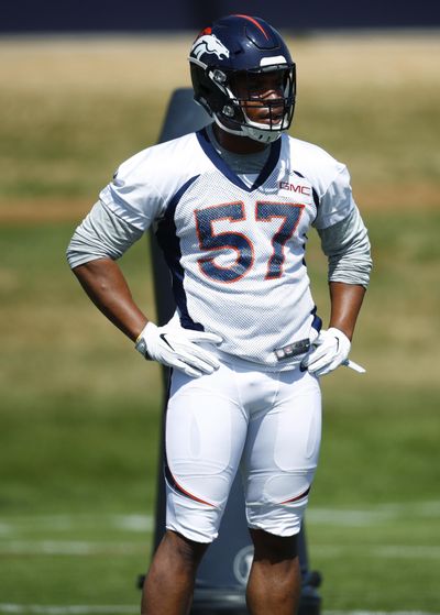 In this Tuesday, May 22, 2018, file photo, Denver Broncos defensive end DeMarcus Walker takes a break during an NFL football practice session at the team’s headquarters in Englewood, Colo. For the season ahead, Walker has added weight to play inside after the Broncos had him slim down for his rookie campaign to be more of an outside pass rusher. (David Zalubowski / Associated Press)