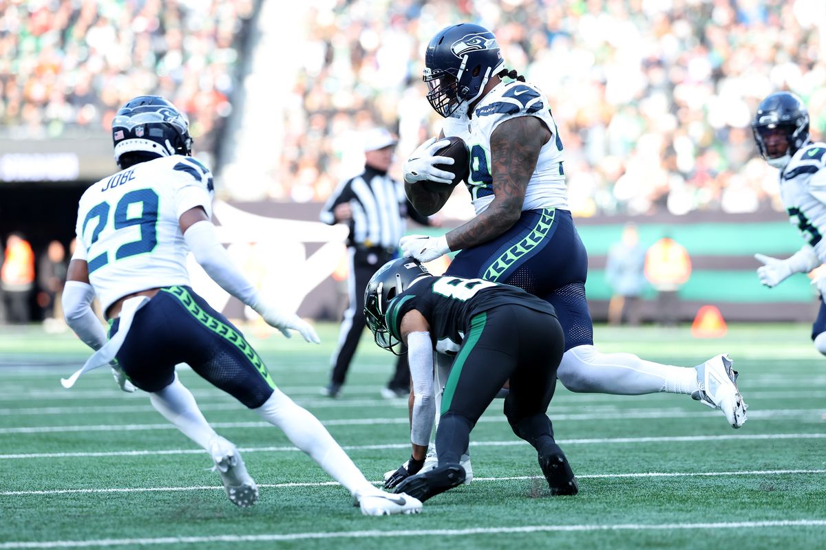 Seahawks DE Leonard Williams returns an interception for a 92-yard touchdown, the longest score by a 300-pound player, during a win over the Jets on Sunday in New York.  (Getty Images)