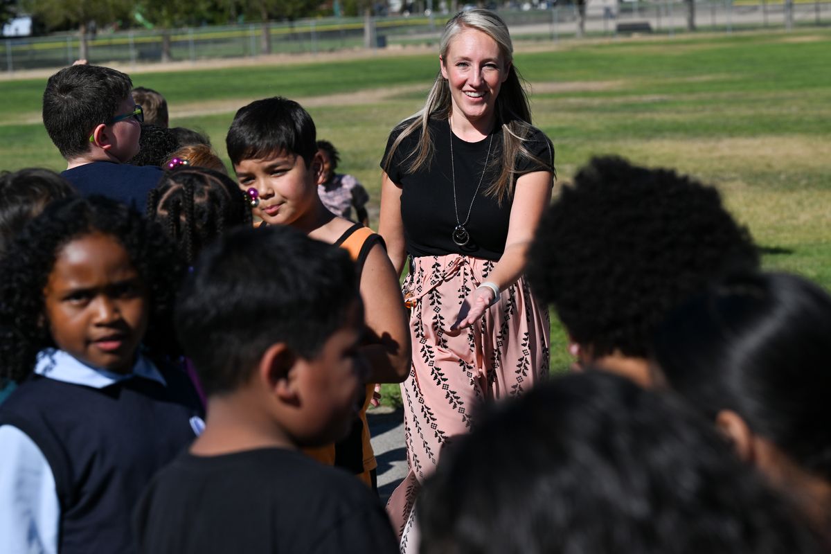 Third-grade teacher Gretchen Cooper ushers her students into a line to return to class after recess on Wednesday at Sunset Elementary in Airway Heights. The Cheney School District is running a bond on November ballots.  (Tyler Tjomsland/The Spokesman-Review)