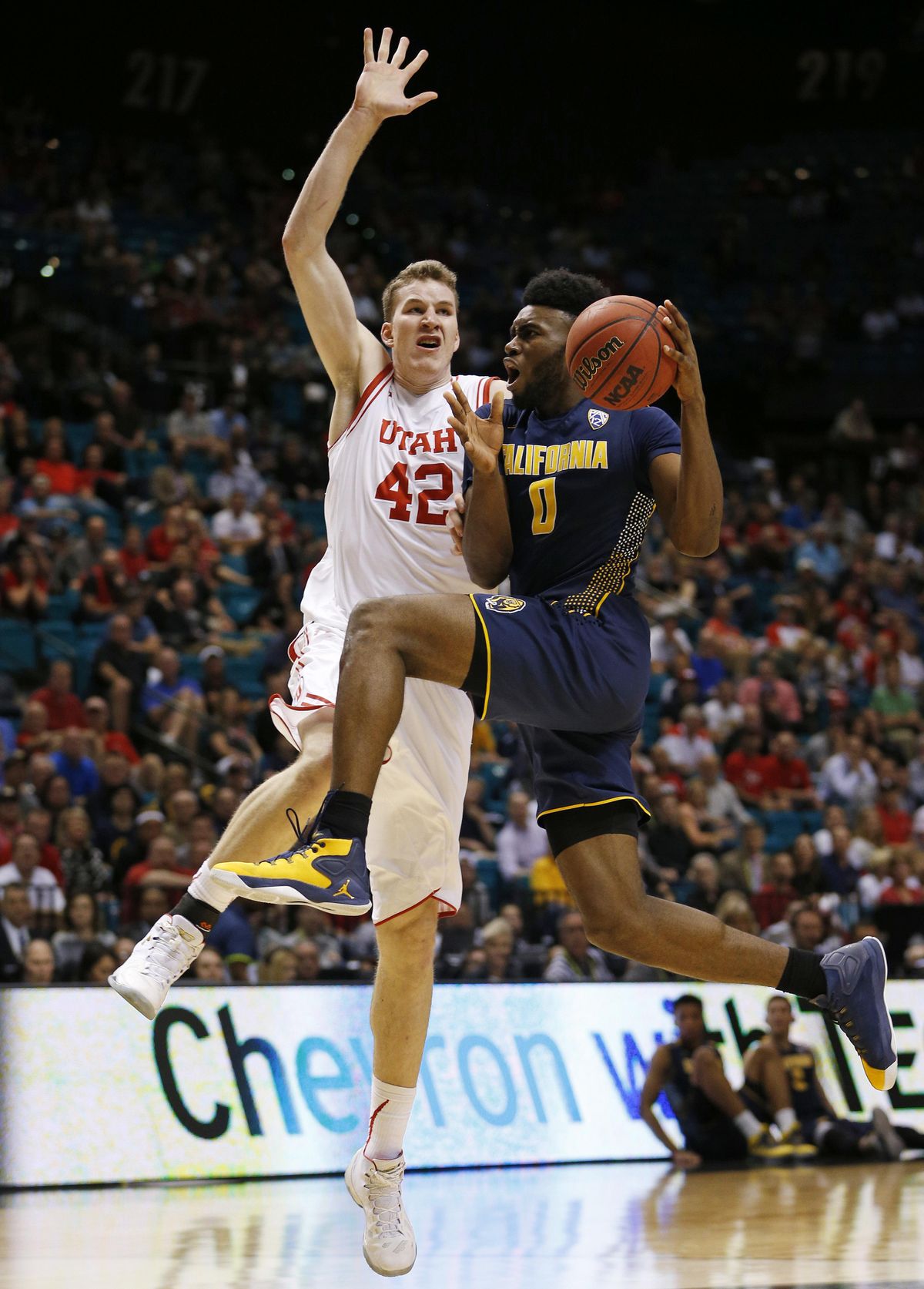 California forward Jaylen Brown, right, drives into Utah forward Jakob Poeltl during the second half of an NCAA college basketball game in the semifinal round of the Pac-12 men’s tournament Friday, March 11, 2016, in Las Vegas. Utah won 82-78 in overtime. (John Locher / Associated Press)