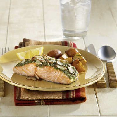 
 Salmon With Almond Pesto, a flavorful but low-fat dish, is quick and easy to make. It includes a double dose of almonds, in the pesto and in the topping. 
 (Associated Press / The Spokesman-Review)