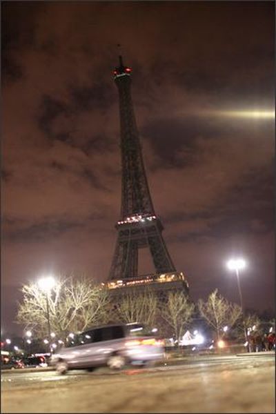 The Eiffel Tower is shown just after the 20,000 bulbs illuminating the tower went out for five minutes. The City of Lights went dim when thousands of Parisians joined in an hour